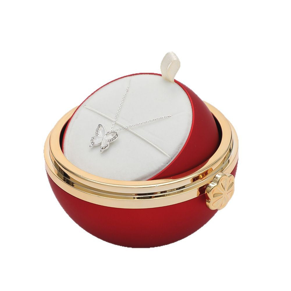 Drehbare Geschenk-Box mit Rosenblume in rot & türkis