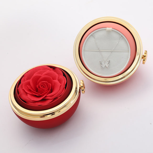 Drehbare Geschenk-Box mit Rosenblume in rot & türkis